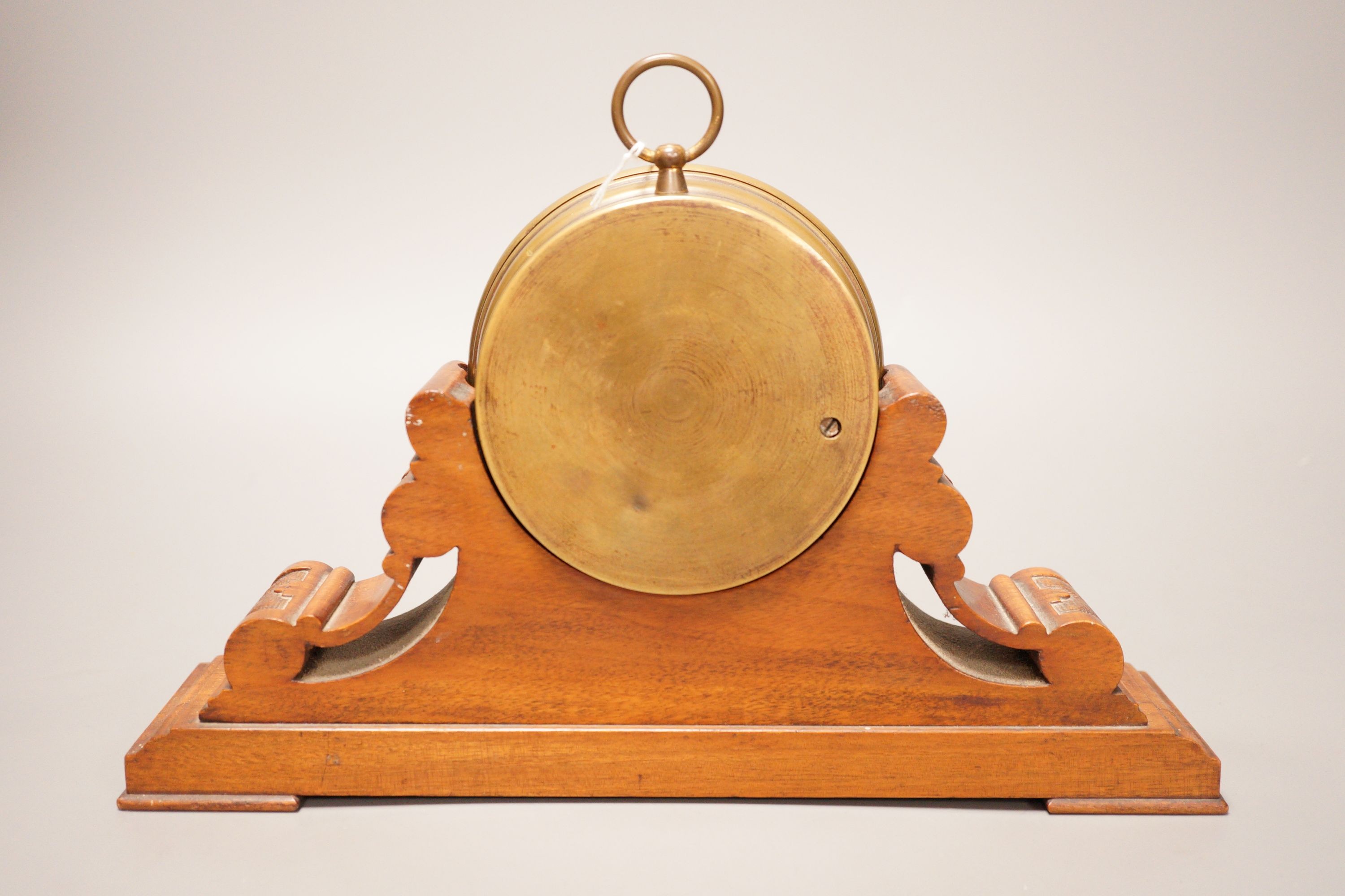 A Negretti & Zambra brass cased barometer on carved walnut stand, 31cm wide